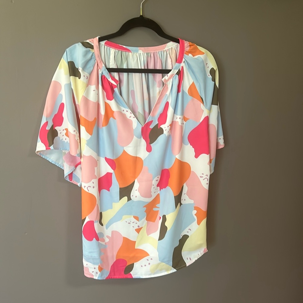 Puchased at local boutique. Size is M but is oversized, fits like a L.
